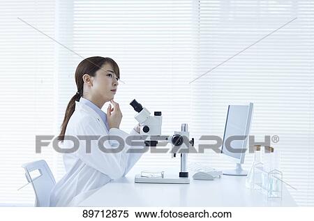 Young Japanese researcher in the lab View Large Photo Image Stock Photography - Young Japanese researcher in the lab. Fotosearch