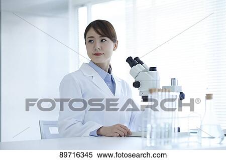 Young Japanese researcher in the lab View Large Photo Image Stock Photography - Young Japanese researcher in the lab. Fotosearch