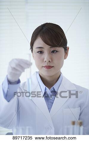 Young Japanese researcher in the lab View Large Photo Image Stock Photography - Young Japanese researcher in the lab. Fotosearch