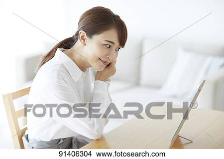 Young Japanese woman at home getting ready in the morning View Large Photo Image Picture - Young Japanese woman at home getting ready in the morning. Fotosearch