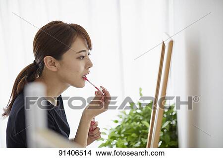 Young Japanese woman at home getting ready in the morning View Large Photo Image Picture - Young Japanese woman at home getting ready in the morning. Fotosearch
