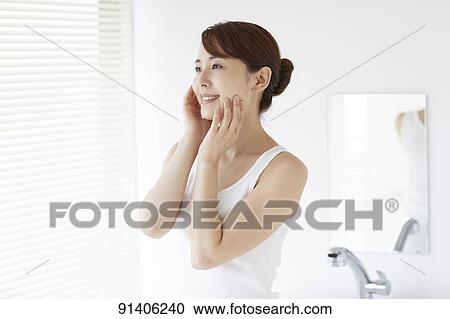 Young Japanese woman at home getting ready in the morning View Large Photo Image Stock Image - Young Japanese woman at home getting ready in the morning. Fotosearch
