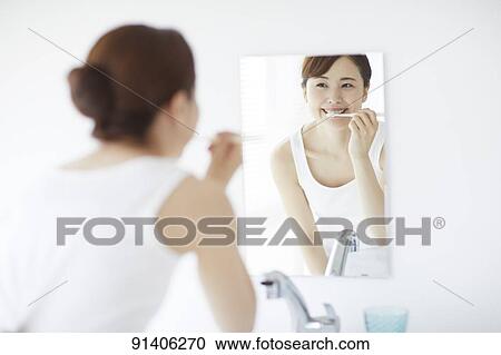 Young Japanese woman at home getting ready in the morning View Large Photo Image Stock Image - Young Japanese woman at home getting ready in the morning. Fotosearch