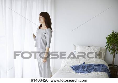 Young Japanese woman at home getting ready in the morning View Large Photo Image Stock Image - Young Japanese woman at home getting ready in the morning. Fotosearch