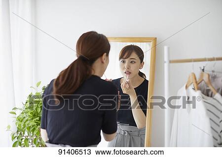 Young Japanese woman at home getting ready in the morning View Large Photo Image Stock Image - Young Japanese woman at home getting ready in the morning. Fotosearch