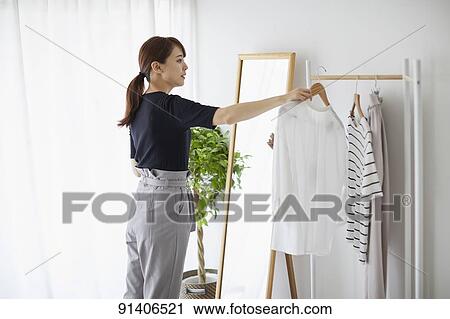 Young Japanese woman at home getting ready in the morning View Large Photo Image Stock Image - Young Japanese woman at home getting ready in the morning. Fotosearch