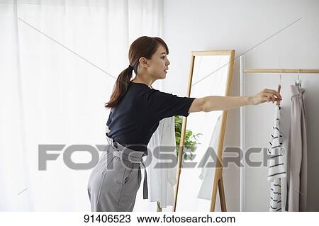 Young Japanese woman at home getting ready in the morning View Large Photo Image Stock Image - Young Japanese woman at home getting ready in the morning. Fotosearch