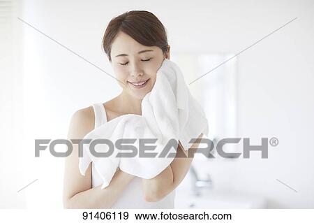 Young Japanese woman at home getting ready in the morning View Large Photo Image Stock Photo - Young Japanese woman at home getting ready in the morning. Fotosearch