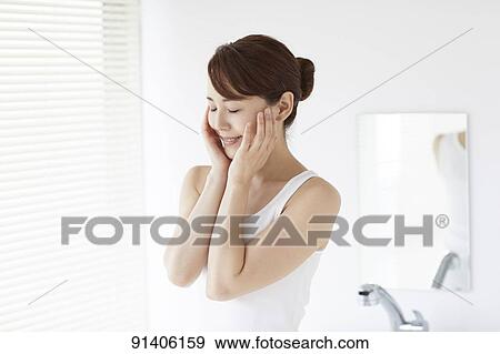 Young Japanese woman at home getting ready in the morning View Large Photo Image Stock Photo - Young Japanese woman at home getting ready in the morning. Fotosearch