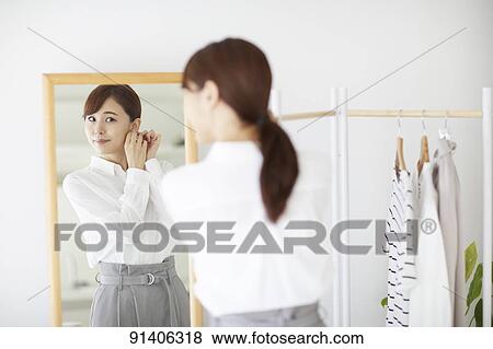 Young Japanese woman at home getting ready in the morning View Large Photo Image Stock Photo - Young Japanese woman at home getting ready in the morning. Fotosearch