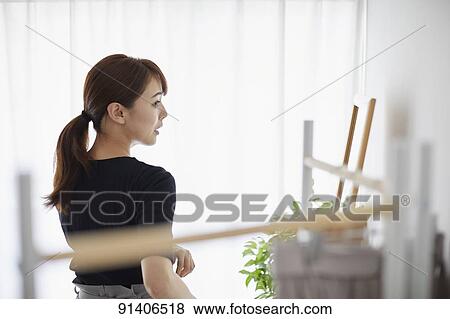 Young Japanese woman at home getting ready in the morning View Large Photo Image Stock Photo - Young Japanese woman at home getting ready in the morning. Fotosearch