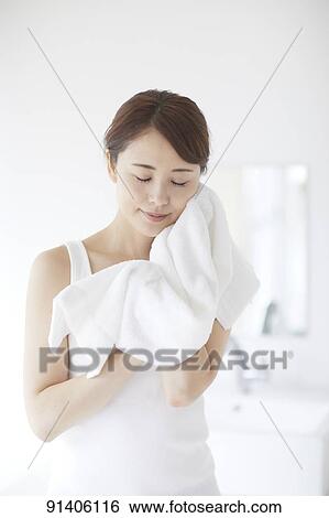 Young Japanese woman at home getting ready in the morning View Large Photo Image Stock Photograph - Young Japanese woman at home getting ready in the morning. Fotosearch