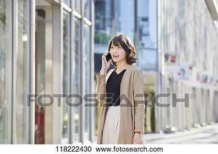 Young Japanese woman downtown Tokyo View Large Photo Image Stock Image - Young Japanese woman downtown Tokyo. Fotosearch