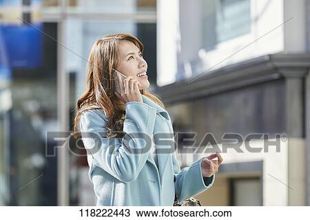 Young Japanese woman downtown Tokyo View Large Photo Image Stock Image - Young Japanese woman downtown Tokyo. Fotosearch