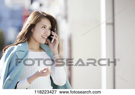 Young Japanese woman downtown Tokyo View Large Photo Image Stock Photo - Young Japanese woman downtown Tokyo. Fotosearch