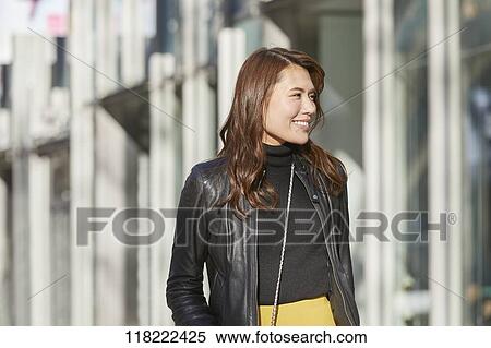 Young Japanese woman downtown Tokyo View Large Photo Image Stock Photography - Young Japanese woman downtown Tokyo. Fotosearch