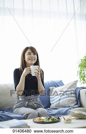Young Japanese woman having breakfast at home View Large Photo Image Stock Image - Young Japanese woman having breakfast at home. Fotosearch
