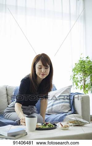 Young Japanese woman having breakfast at home View Large Photo Image Stock Image - Young Japanese woman having breakfast at home. Fotosearch