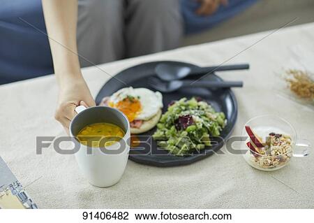 Young Japanese woman having breakfast at home View Large Photo Image Stock Image - Young Japanese woman having breakfast at home. Fotosearch