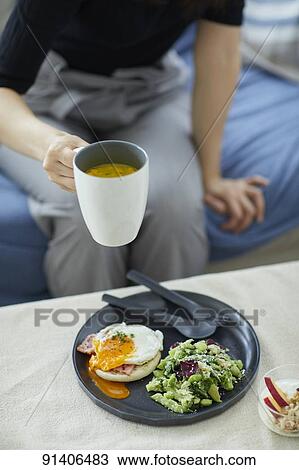 Young Japanese woman having breakfast at home View Large Photo Image Stock Image - Young Japanese woman having breakfast at home. Fotosearch