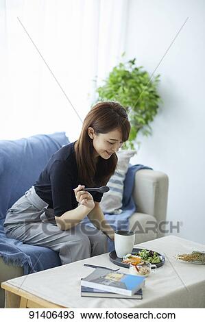 Young Japanese woman having breakfast at home View Large Photo Image Stock Image - Young Japanese woman having breakfast at home. Fotosearch