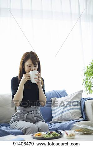 Young Japanese woman having breakfast at home View Large Photo Image Stock Photo - Young Japanese woman having breakfast at home. Fotosearch