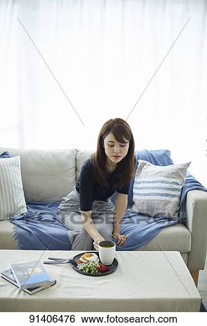 Young Japanese woman having breakfast at home View Large Photo Image Stock Photograph - Young Japanese woman having breakfast at home. Fotosearch