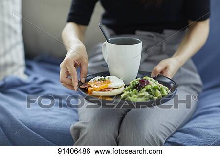 Young Japanese woman having breakfast at home View Large Photo Image Stock Photograph - Young Japanese woman having breakfast at home. Fotosearch