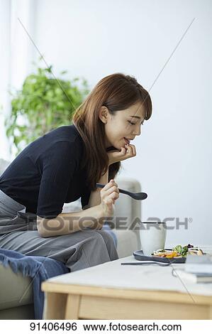 Young Japanese woman having breakfast at home View Large Photo Image Stock Photograph - Young Japanese woman having breakfast at home. Fotosearch