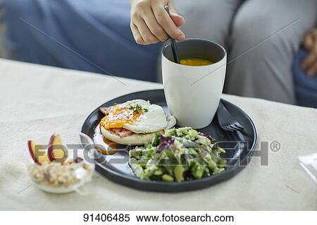 Young Japanese woman having breakfast at home View Large Photo Image Stock Photography - Young Japanese woman having breakfast at home. Fotosearch