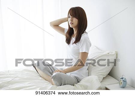 Young Japanese woman in bed in the morning View Large Photo Image Picture - Young Japanese woman in bed in the morning. Fotosearch