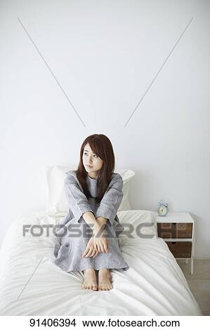 Young Japanese woman in bed in the morning View Large Photo Image Picture - Young Japanese woman in bed in the morning. Fotosearch