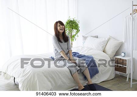 Young Japanese woman in bed in the morning View Large Photo Image Stock Image - Young Japanese woman in bed in the morning. Fotosearch