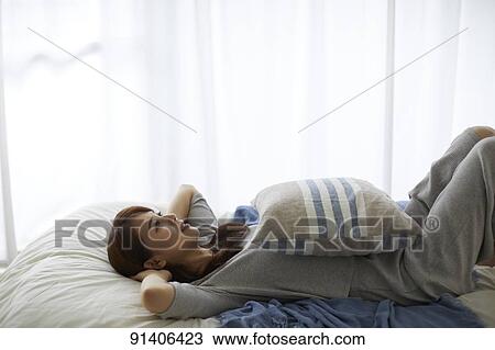 Young Japanese woman in bed in the morning View Large Photo Image Stock Image - Young Japanese woman in bed in the morning. Fotosearch