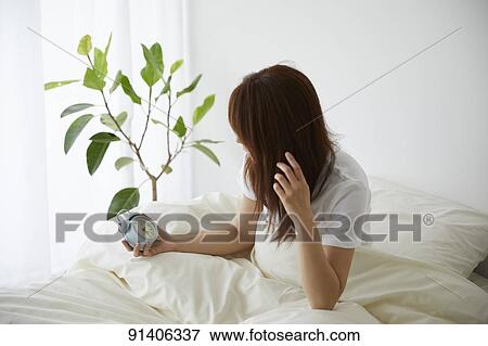 Young Japanese woman in bed in the morning View Large Photo Image Stock Photo - Young Japanese woman in bed in the morning. Fotosearch