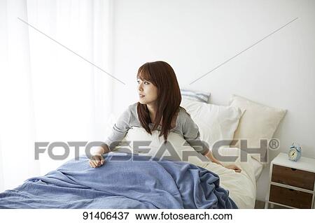 Young Japanese woman in bed in the morning View Large Photo Image Stock Photo - Young Japanese woman in bed in the morning. Fotosearch