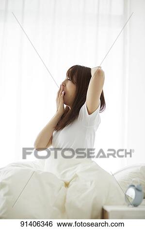 Young Japanese woman in bed in the morning View Large Photo Image Stock Photograph - Young Japanese woman in bed in the morning. Fotosearch