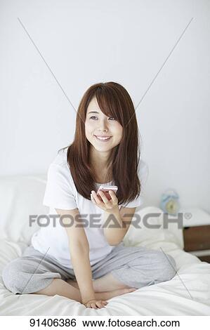 Young Japanese woman in bed in the morning View Large Photo Image Stock Photograph - Young Japanese woman in bed in the morning. Fotosearch