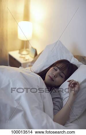 Young Japanese woman in bed View Large Photo Image Picture - Young Japanese woman in bed. Fotosearch