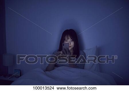 Young Japanese woman in bed View Large Photo Image Picture - Young Japanese woman in bed. Fotosearch
