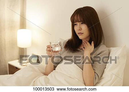 Young Japanese woman in bed View Large Photo Image Stock Image - Young Japanese woman in bed. Fotosearch