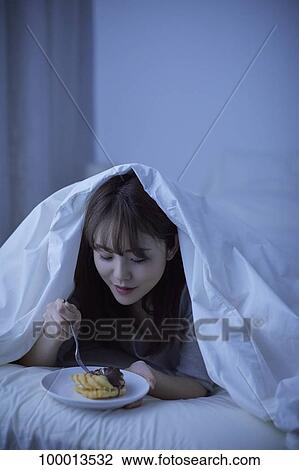 Young Japanese woman in bed View Large Photo Image Stock Image - Young Japanese woman in bed. Fotosearch