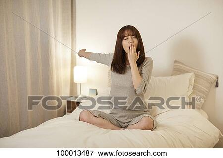 Young Japanese woman in bed View Large Photo Image Stock Photo - Young Japanese woman in bed. Fotosearch