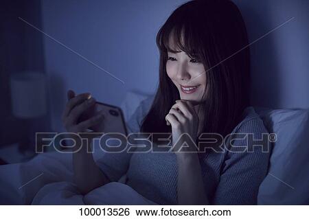 Young Japanese woman in bed View Large Photo Image Stock Photograph - Young Japanese woman in bed. Fotosearch