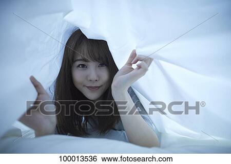 Young Japanese woman in bed View Large Photo Image Stock Photograph - Young Japanese woman in bed. Fotosearch