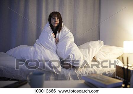 Young Japanese woman in bed View Large Photo Image Stock Photograph - Young Japanese woman in bed. Fotosearch