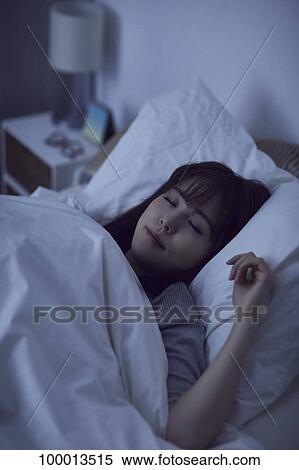 Young Japanese woman in bed View Large Photo Image Stock Photography - Young Japanese woman in bed. Fotosearch