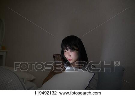 Young Japanese woman in her house View Large Photo Image Stock Image - Young Japanese woman in her house. Fotosearch