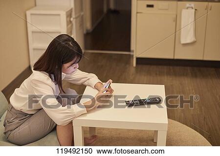 Young Japanese woman in her house View Large Photo Image Stock Image - Young Japanese woman in her house. Fotosearch