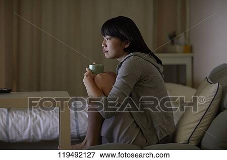 Young Japanese woman in her house View Large Photo Image Stock Photo - Young Japanese woman in her house. Fotosearch